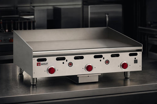 Wolf ASA36 heavy-duty countertop gas griddle with polished steel plate in a commercial kitchen