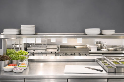 Bright restaurant preparation counter with organized ingredients and a clear service pass
