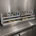 Thumbnail image #3 for Glastender 54-Inch Double Stainless Steel Speed Rail with Open Step-and-Rail Design