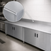 Thumbnail image #3 for Advance Tabco Special Value Series Enclosed Work Table with Cabinet Base, 108 x 24 Inches, 16-Gauge 304 Stainless Steel Top, 5-Inch Backsplash