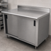 Thumbnail image #3 for Advance Tabco 96-Inch x 36-Inch Enclosed Work Table with Cabinet Base, Sliding Doors, 14-Gauge 304 Stainless Steel Top, and 5-Inch Backsplash
