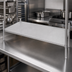Thumbnail image #3 for Advance Tabco 18 Inch x 48 Inch Solid Stainless Steel Shelf with Plastic Split Sleeves