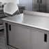 Thumbnail image #3 for Advance Tabco 144-Inch Enclosed Stainless Steel Work Table with Sliding Doors, 14-Gauge Top and 1-1/2-Inch Rear Up-Turn
