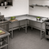 Thumbnail image #3 for Advance Tabco L-Shaped Stainless Steel Corner Work Table, 96 x 60 Inch, 30-Inch Deep, 14-Gauge 304 Top, 5-Inch Backsplash