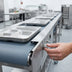 Thumbnail image #2 for Dinex DXIESFB12 12 ft. Variable Speed Fabric Belt Tray Make-Up Conveyor