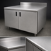 Thumbnail image #3 for Advance Tabco Special Value Economy Enclosed Work Table with Cabinet Base, 96 x 24 Inches, 16-Gauge 304 Stainless Steel Top, 5-Inch Backsplash