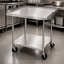 Thumbnail image #3 for 36-Inch High Stainless Steel Equipment Stand with Adjustable Undershelf, V-Edge Front, Side and Rear Splash, and Casters