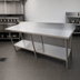 Thumbnail image #3 for Omcan 84-Inch x 30-Inch Stainless Steel Flat-Top Work Table with 4-Inch Backsplash and Undershelf