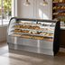 Thumbnail image #3 for True 77-1/4 Inch Curved Glass Dry Pastry Display Case with Solid Colored End, Stainless Steel Interior/Exterior
