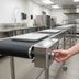 Thumbnail image #2 for Dinex DXIESFB16 16-Foot Fabric Belt Tray Make-Up Conveyor