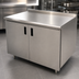 Thumbnail image #3 for Advance Tabco 84-Inch Enclosed Work Table with Cabinet Base, Mid-Shelf, Hinged Doors, and 304 Stainless Steel Top
