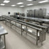 Thumbnail image #2 for Dinex 14-Foot Stainless Steel Skate Wheel Tray Make-Up Conveyor