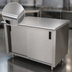 Thumbnail image #3 for Advance Tabco 60 x 30 Inch Enclosed Work Table with Cabinet Base, Mid-Shelf and Sliding Doors, 14 Gauge 304 Stainless Steel Top