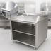 Thumbnail image #3 for 120-Inch x 24-Inch Open Front Cabinet Base Work Table with Fixed Mid-Shelf, 14-Gauge 304 Stainless Steel Top, 1-1/2-Inch Rear Splash