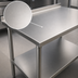 Thumbnail image #3 for John Boos Stallion 48 x 24 Inch Stainless Steel Top Work Table with 1-1/2 Inch Rear Riser and Undershelf