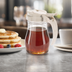Thumbnail image #3 for Dripcut® 7 oz. Clear Polycarbonate Syrup Server with Almond Plastic Top