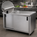 Thumbnail image #3 for Advance Tabco 60 Inch x 36 Inch Enclosed Work Table with Cabinet Base, Mid-Shelf, Sliding Doors, and 14-Gauge 304 Stainless Steel Flat Top