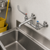 Thumbnail image #3 for T&S Brass Wall-Mount Service Sink Faucet with 8-Inch Centers, 12-Inch Spout, 6-Inch Wrist Handles, Pail Hook, and Integral Stops
