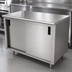 Thumbnail image #3 for Advance Tabco Special Value Economy Enclosed Work Table with Cabinet Base, Mid-Shelf and Sliding Doors, 84 x 30 Inches, 16 Gauge 304 Stainless Steel Top