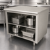 Thumbnail image #4 for Advance Tabco 60 Inch x 30 Inch Open Front Cabinet Base Work Table with Mid-Shelf and 14 Gauge 304 Stainless Steel Top