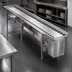 Thumbnail image #4 for Dinex DXIESR18 Tray Make-Up Conveyor with PVC Rollers, 18 ft. Section