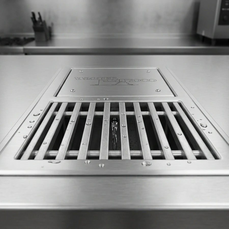 Observe the robust subway-style grating designed for efficient and sturdy drainage in this professional water tempering system.