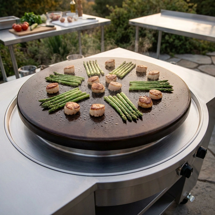 Showcasing the expansive 30-inch black seasoned steel plancha, designed for exceptional heat retention and a naturally non-stick cooking experience.