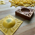 Thumbnail image #1 for JB Prince UA207 D Maple Wood Ravioli Mold, 4.5" x 4.5" x 1", Sunburst Pattern, with Mini Rolling Pin and Linen Storage Case