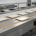 Thumbnail image #4 for Dinex DXIESB12 12 ft. Dual Urethane Band Belt Tray Make-Up Conveyor