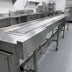 Thumbnail image #4 for Dinex DXIESSB16 16-Foot Slat Belt Motorized Tray Make-Up Conveyor