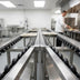 Thumbnail image #4 for Dinex 14-Foot Stainless Steel Skate Wheel Tray Make-Up Conveyor