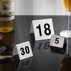 Thumbnail image #2 for New Star Foodservice Inc. 27655 Tent-Style Stainless Steel Table Numbers, 76–100, 2" x 1-1/2" Case of 12