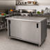 Thumbnail image #2 for Advance Tabco Special Value Series Economy Flat-Top Enclosed Work Table with Cabinet Base, Mid-Shelf, and Sliding Doors, 120 x 24 Inches, 16-Gauge 304 Stainless Steel Top