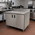 Thumbnail image #2 for Advance Tabco Enclosed Stainless Steel Work Table with Cabinet Base, Mid-Shelf, Hinged Doors, 48 x 24 Inch, 5-Inch Backsplash