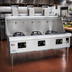 Thumbnail image #2 for York 3-Chamber Gas Wok Range with Water-Cooled Top and Chinese Swing Faucets