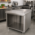 Thumbnail image #2 for Advance Tabco 48 Inch x 24 Inch Stainless Steel Open Front Cabinet Base Work Table with 1-1/2 Inch Rear Backsplash