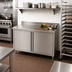 Thumbnail image #2 for John Boos Enclosed Work Table with Hinged Doors, 48 Inch x 24 Inch, 14-Gauge 300-Series Stainless Steel Top, 5-Inch Backsplash