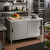Thumbnail image #2 for BK Resources Dual Access Stainless Steel Chef Table with Cabinet Base, 48 x 24 Inches