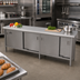 Thumbnail image #2 for John Boos Enclosed Stainless Steel Work Table with Sliding Door Cabinet Base, 108 x 24 Inch Flat Top