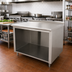 Thumbnail image #2 for Advance Tabco 60 Inch x 36 Inch Open Front Cabinet Base Work Table with 14 Gauge 304 Stainless Steel Top and 1-1/2 Inch Rear Up-Turn