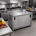 Thumbnail image #2 for Advance Tabco Special Value Series 72-Inch x 24-Inch Enclosed Work Table with Cabinet Base, Mid-Shelf, Sliding Doors, 16-Gauge 304 Stainless Steel Top, and 5-Inch Backsplash