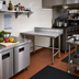 Thumbnail image #2 for Advance Tabco 30 Inch x 24 Inch Corner Stainless Steel Work Table with 5 Inch Backsplash