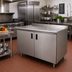 Thumbnail image #2 for Advance Tabco 60 x 24 Inch Enclosed Stainless Steel Work Table with Cabinet Base, Mid-Shelf and Hinged Doors, 14 Gauge 304 Top, 1-1/2 Inch Rear Up-Turn