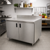 Thumbnail image #2 for Advance Tabco Special Value Economy Enclosed Work Table with Cabinet Base, 84 x 24 Inches, 16-Gauge 304 Stainless Steel Top, 5-Inch Backsplash