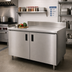 Thumbnail image #2 for Advance Tabco Special Value Series 60-Inch W x 30-Inch D Enclosed Work Table with Cabinet Base, 16-Gauge 304 Stainless Steel Top and 5-Inch Backsplash