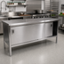 Thumbnail image #2 for John Boos Cabinet Base Enclosed Work Table with Sliding Doors, 108 x 30 Inch, 14-Gauge 300-Series Stainless Steel Flat Top