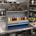 Thumbnail image #2 for Advance Tabco Prestige Single-Tier Stainless Steel Speed Rail with Locking Cover, 42-Inch, 10-Bottle Capacity