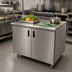 Thumbnail image #2 for Advance Tabco Special Value Series Enclosed Work Table with Cabinet Base, Mid-Shelf and Hinged Doors, 36 x 30 Inches, 16-Gauge 304 Stainless Steel Top