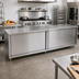 Thumbnail image #2 for John Boos 132-Inch x 30-Inch Stainless Steel Cabinet Base Work Table with Sliding Doors and Stallion Safety Edge
