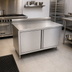 Thumbnail image #2 for John Boos Enclosed Stainless Steel Work Table with Cabinet Base and Hinged Doors, 36